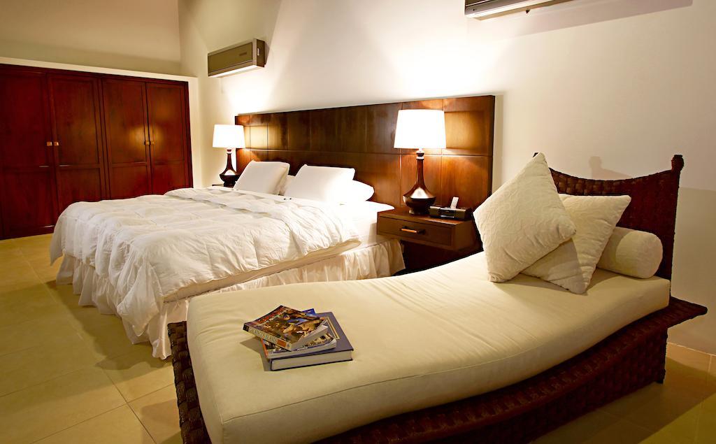 Iguana Crossing Boutique Hotel Puerto Villamil Zimmer foto